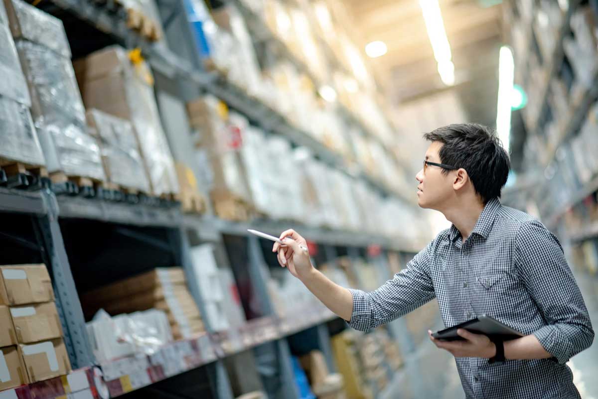 Man checking the inventory at the Storage Facility